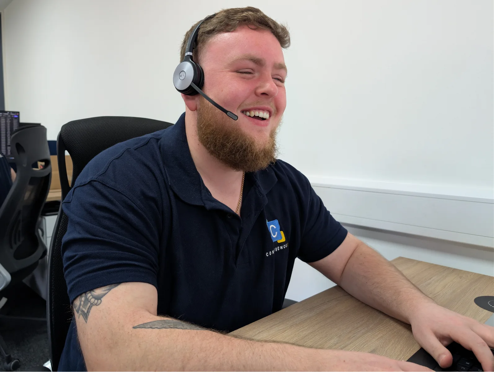 Xavi from the Confidence IT team at work in the office